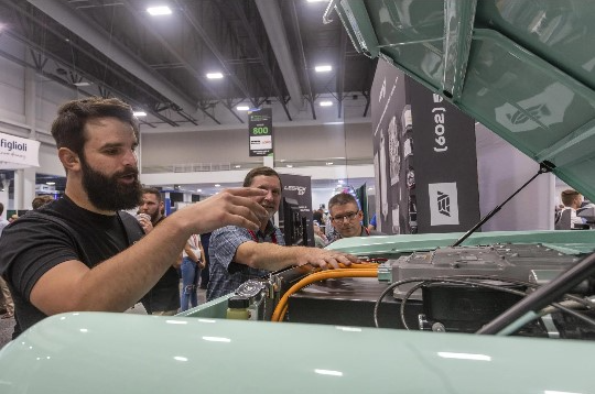 Photo of man showing industrial battery
