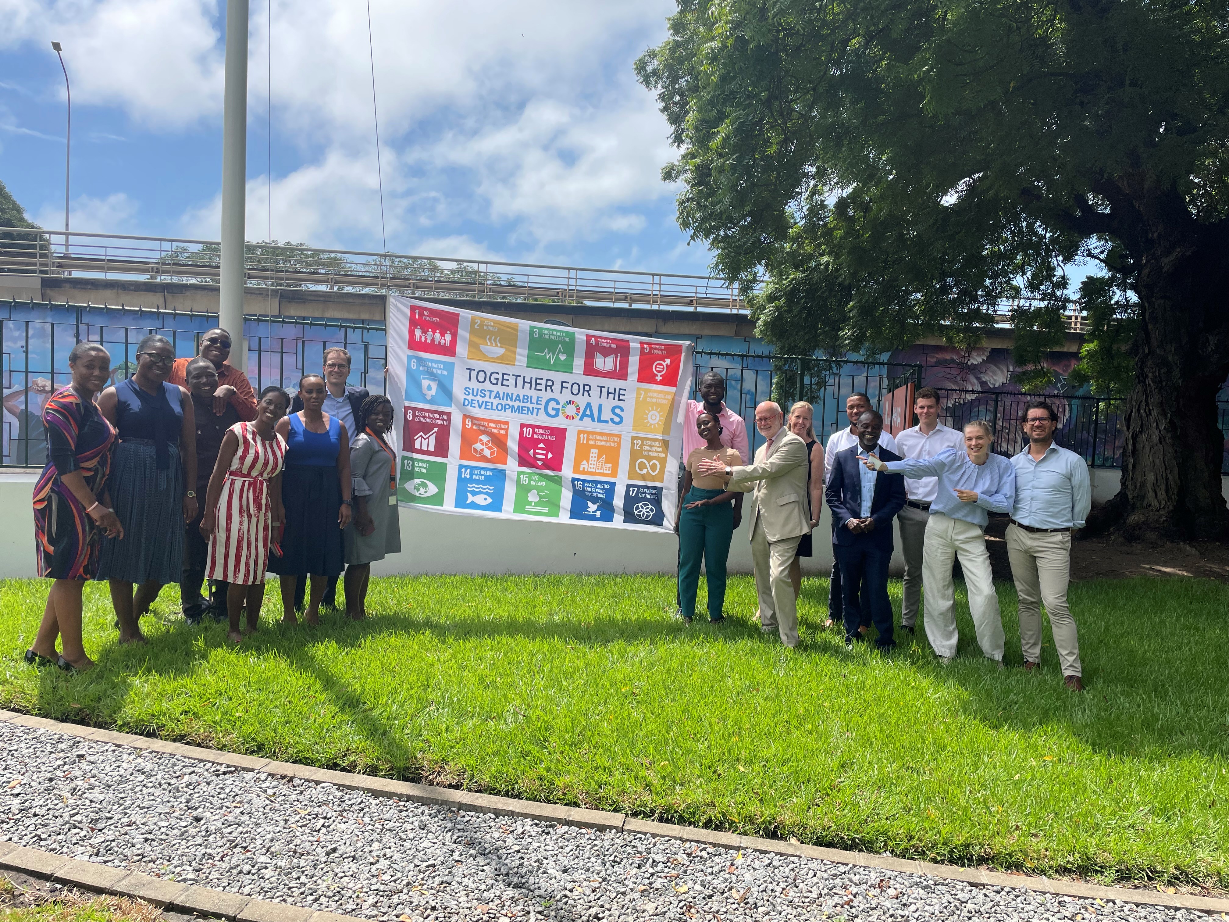 Staff of EKN in Accra hoist the SDG Flag