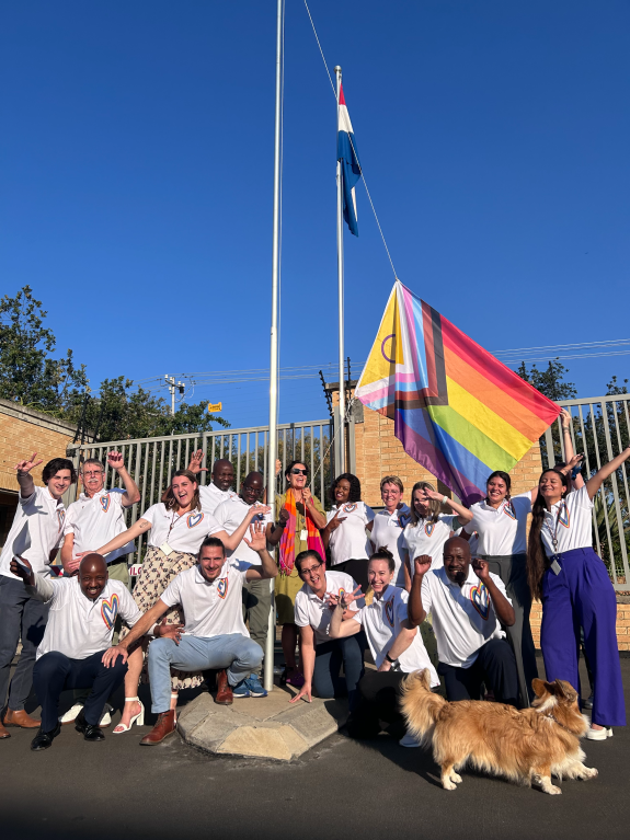 The Embassy of the Kingdom of the Netherlands team during the launch of the raising of the progressive pride flag and before the Pride Rainbow Flag Driveway launch.